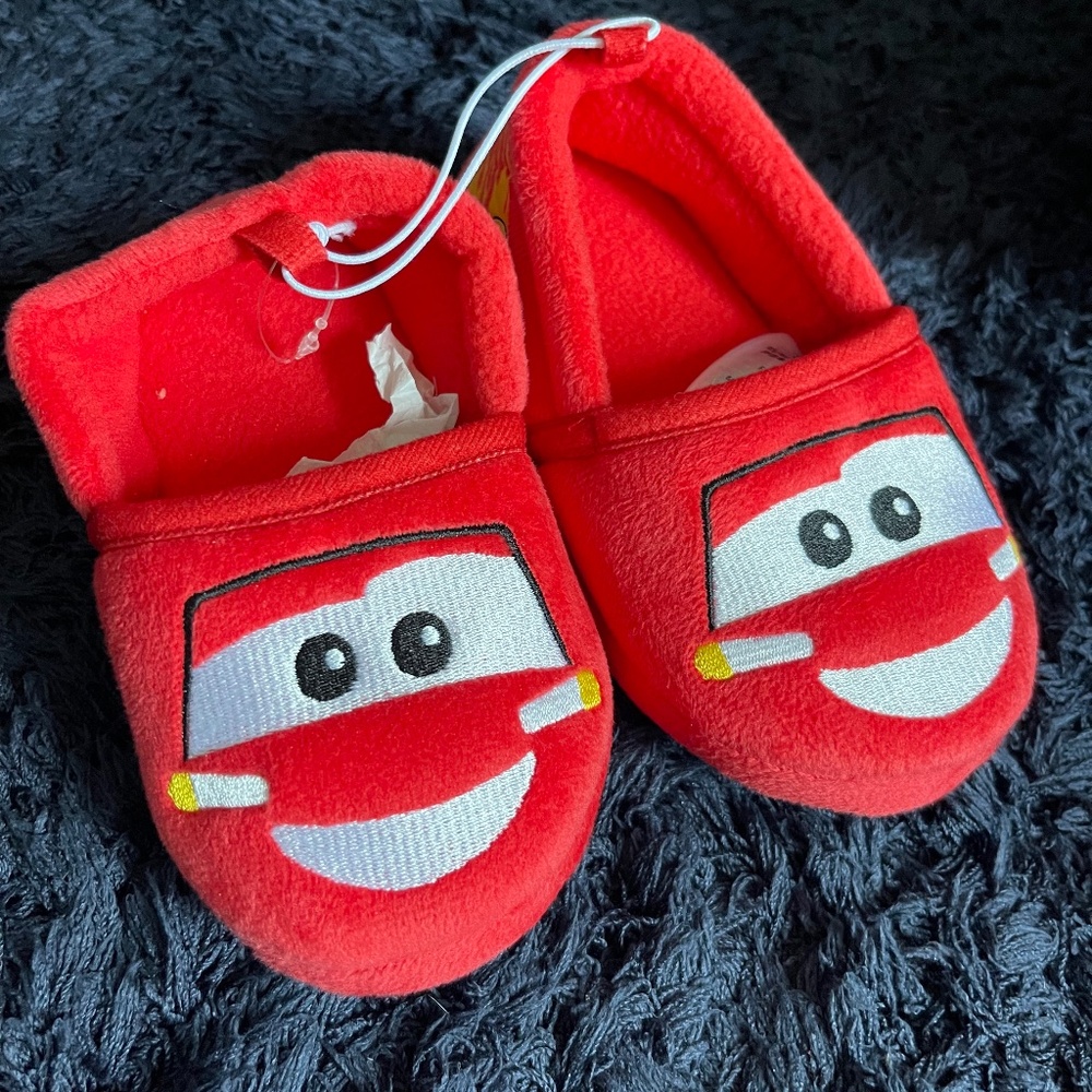 Never worn light McQueen slippers size 7/8 toddler